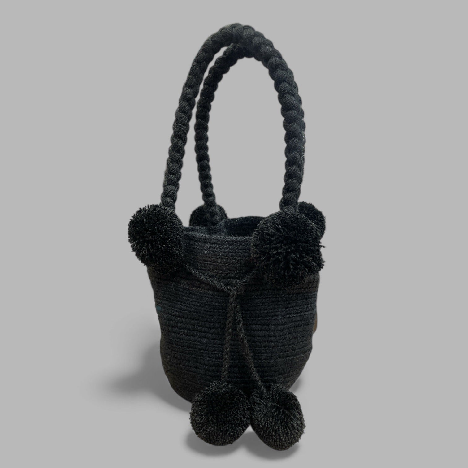 Mini mochila Wayuù nera con manico intrecciato borsa compatta resistente